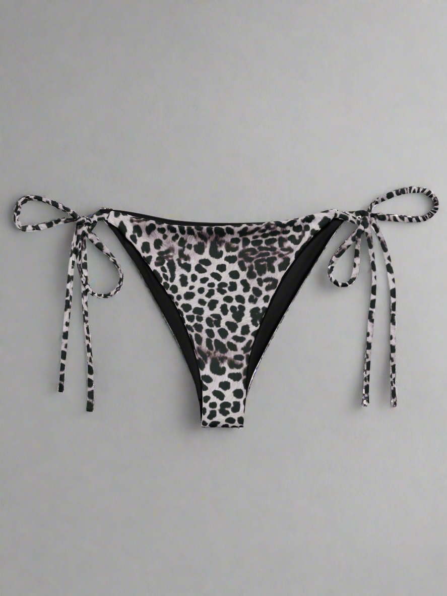 Leopard print bikini bottom with tie sides on a light gray background