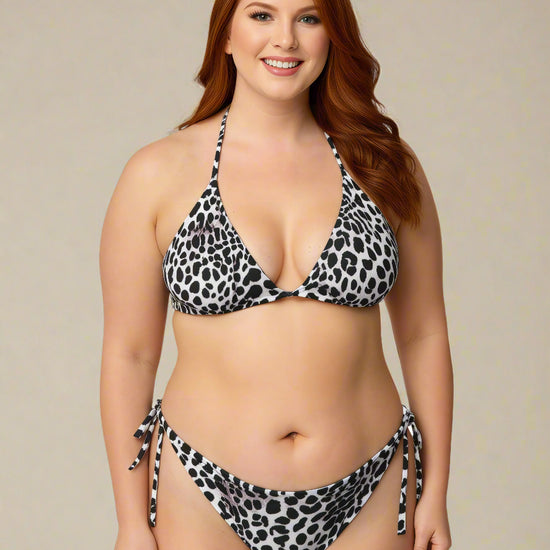 Woman wearing a leopard print bikini against a beige background