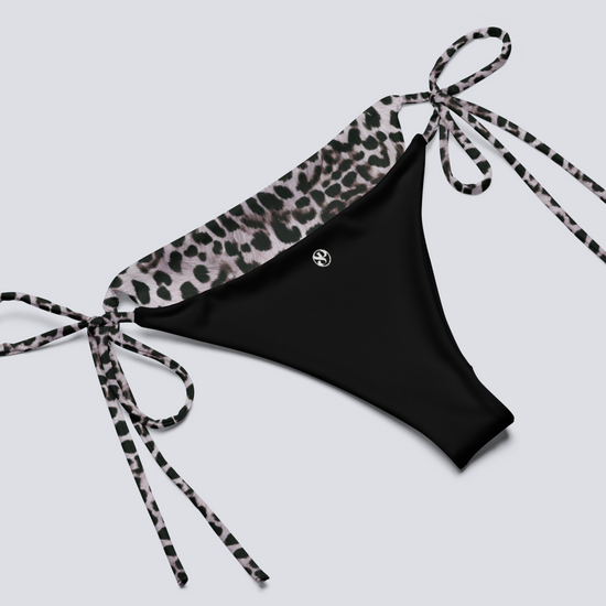Black bikini bottom with leopard print tie on a light gray background