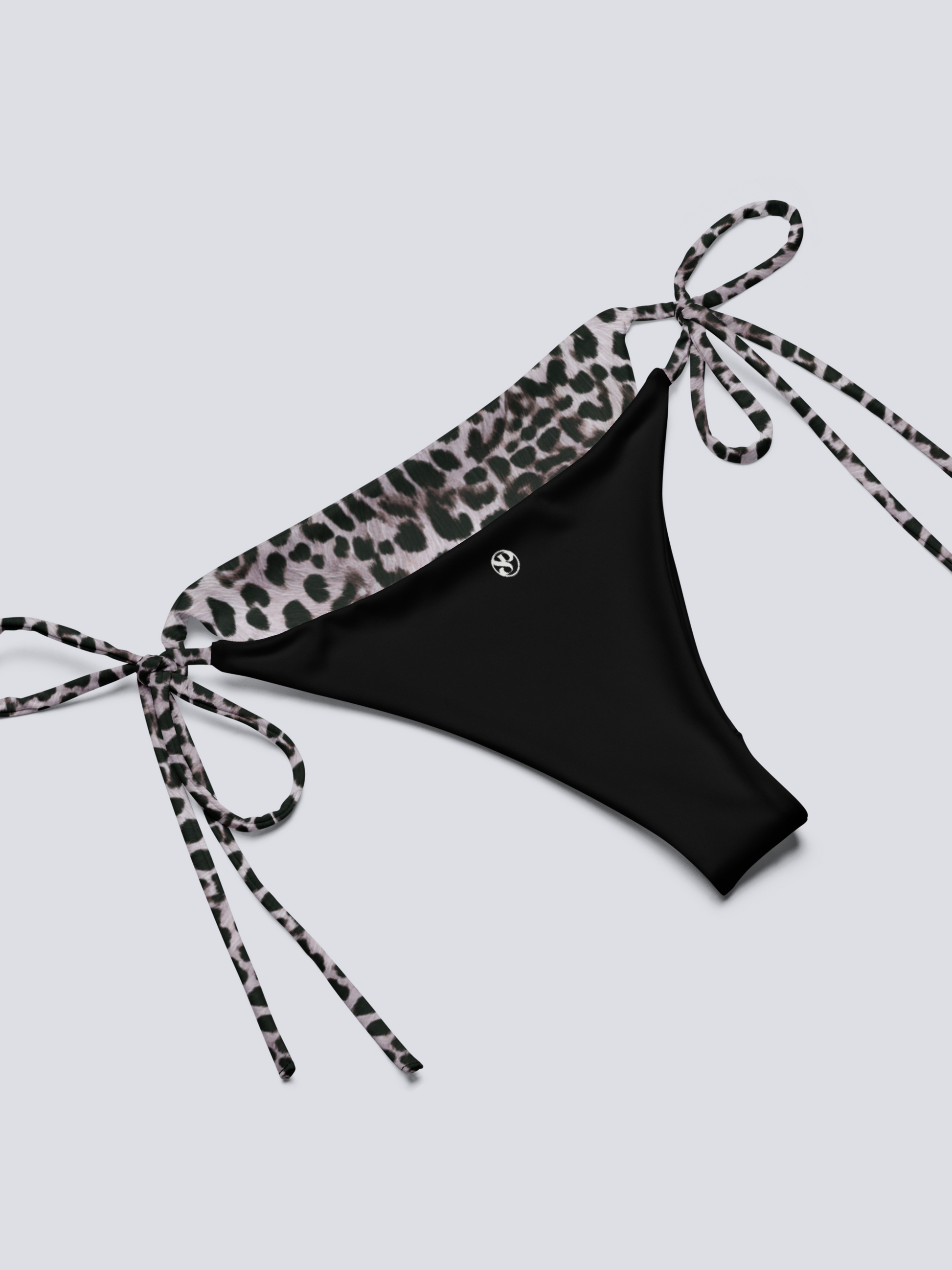 Black bikini bottom with leopard print tie on a light gray background