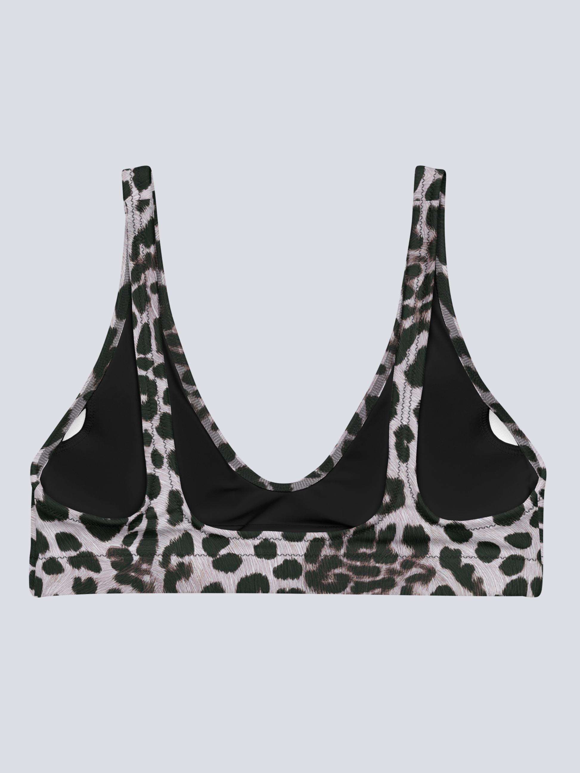 Flat-lay of Savannah Charge Surf Bikini Top in black, white, and dark green leopard print with deep scoop neckline and wide straps – bold, sculpting swimwear by Pixie & Sherbet.