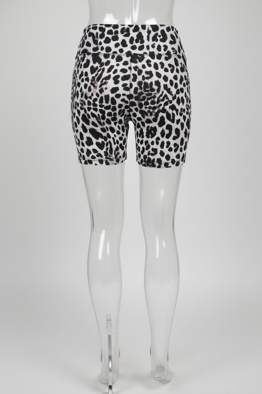 Rear view of a mannequin wearing high-waisted biker shorts with a black leopard print on a white background, shown against a plain white studio backdrop.