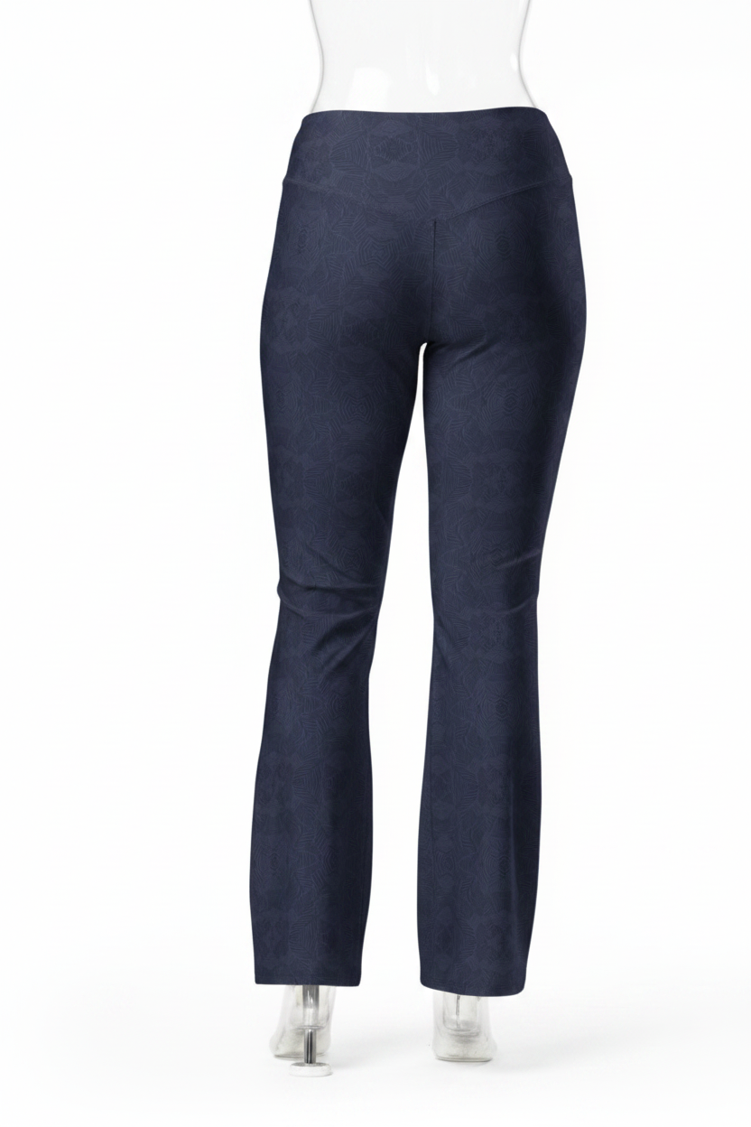 A mannequin shown from the back wearing dark navy blue straight-leg pants, a white long-sleeve top, and white shoes against a plain white studio background.