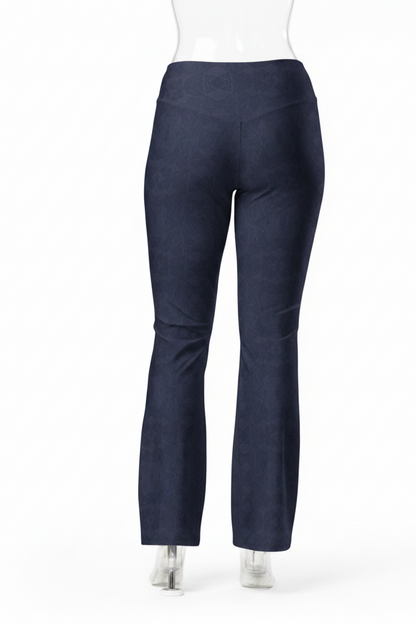 A mannequin shown from the back wearing dark navy blue straight-leg pants, a white long-sleeve top, and white shoes against a plain white studio background.