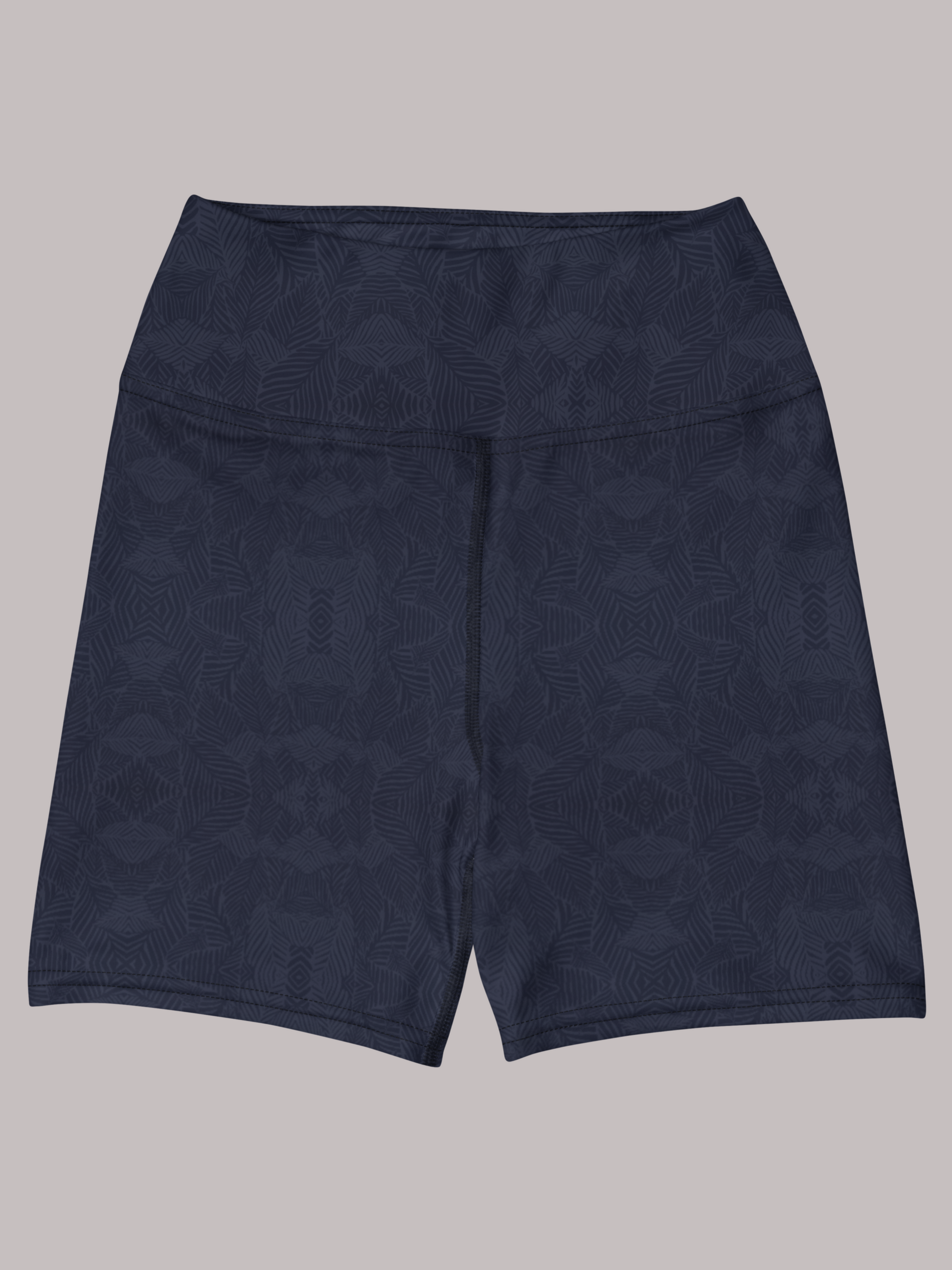 Front view of navy and blue, Shadow leaf Yoga shorts with gentle leaf pattern on a light grey background