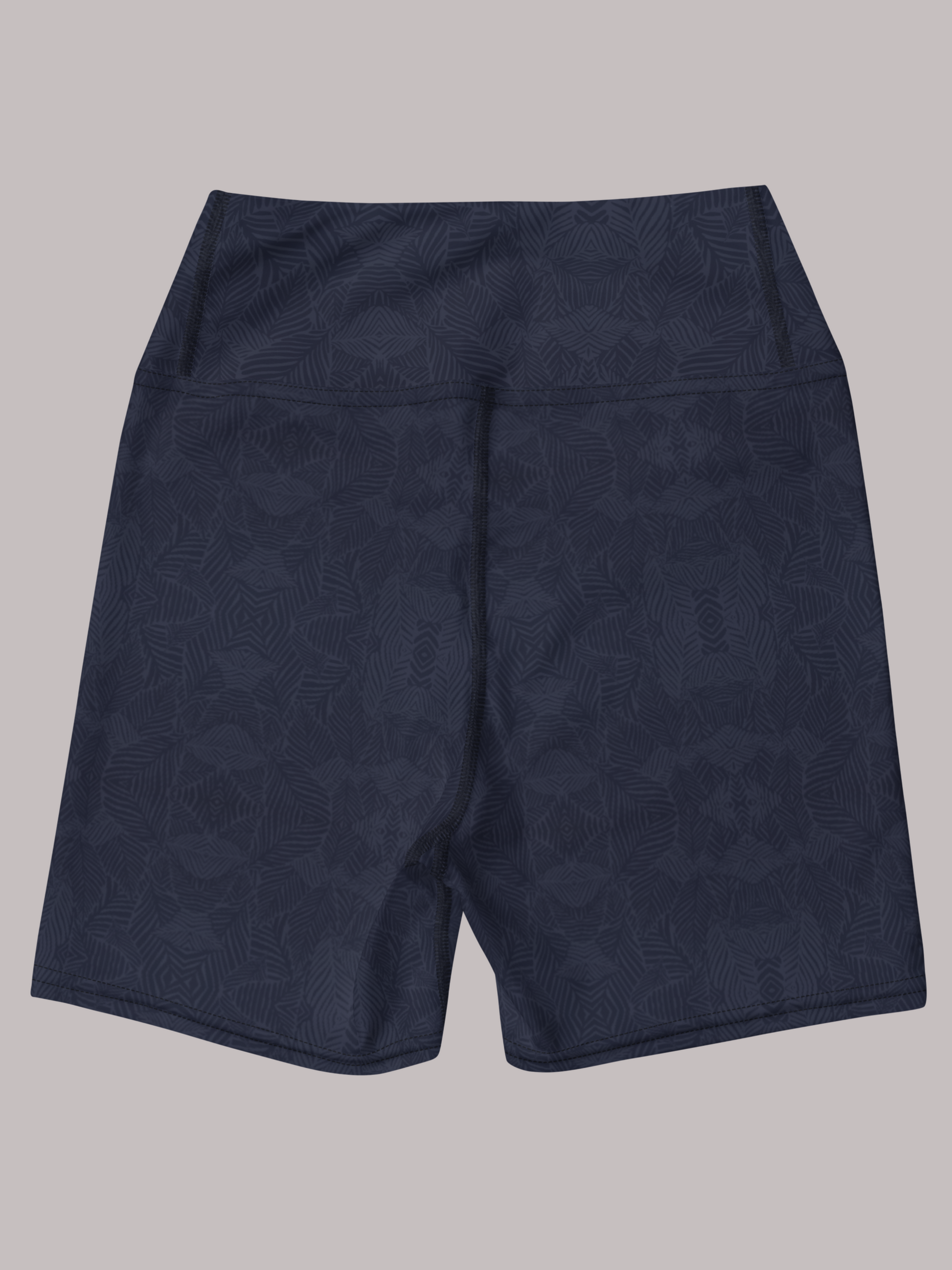 Back view of navy and blue, Shadow leaf Yoga shorts with gentle leaf pattern on a light grey background by Pixie and Sherbet.
