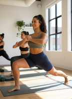 Woman practicing yoga in a studio with large windows
