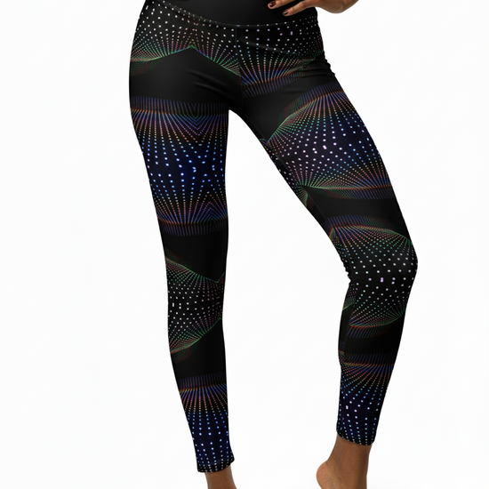Black leggings with colorful geometric pattern worn by a person on a white background