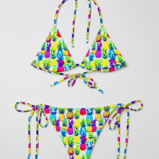 Back, flat-lay view of bright yellow, pink, purple and blue coloured Tropic Like It's Hot String bikini, by Pixie and Sherbet.