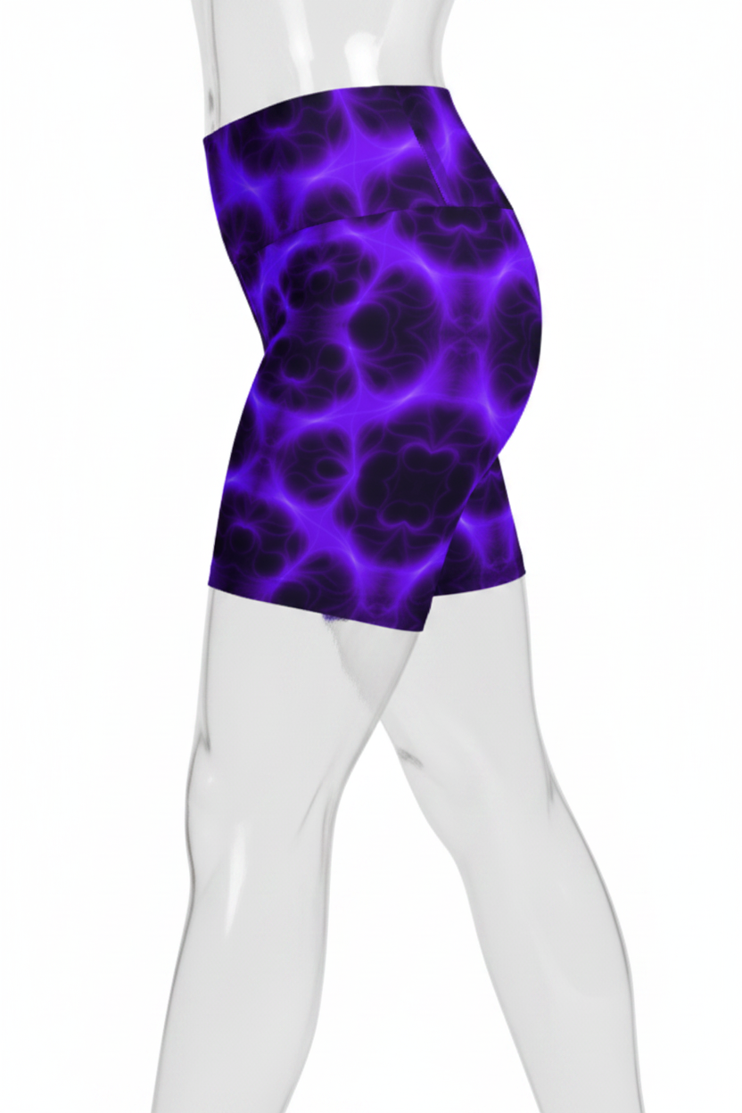 A mannequin wearing high-waisted athletic shorts with a purple and black glowing cellular or crackle pattern, shown from the waist down on a white background.