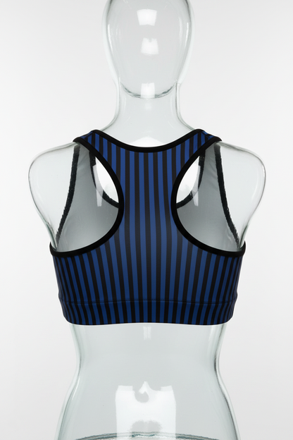 A sleeveless racerback-style top with a navy and black vertical stripe pattern on the front and solid white panels on the back, shown against a plain white background. 