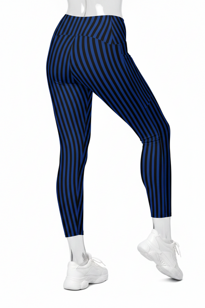 A mannequin wearing high-waisted leggings with vertical navy and dark blue stripes, paired with white sneakers, shown from the waist down on a plain white background.