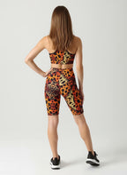 Woman wearing a leopard print sports outfit on a white background