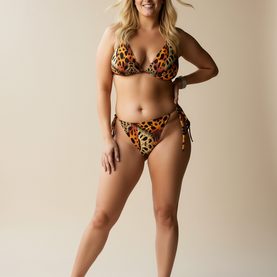 Woman wearing a leopard print bikini on a white background